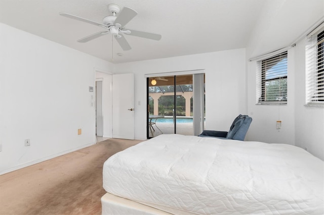 carpeted bedroom with access to outside and ceiling fan