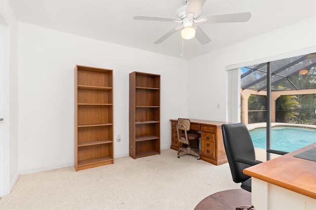 office featuring ceiling fan and light colored carpet