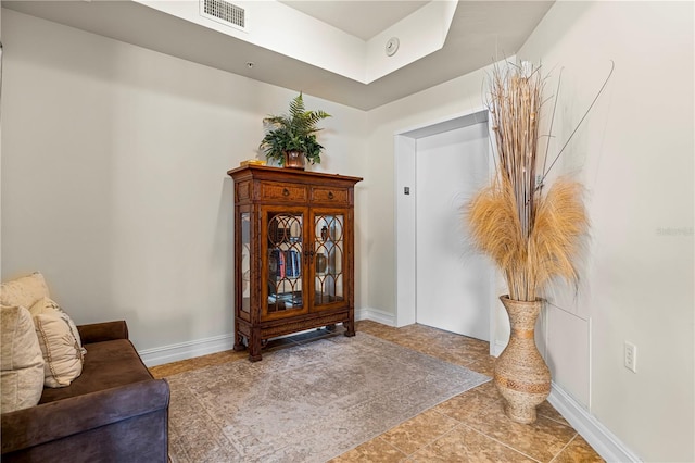 sitting room featuring tile patterned flooring