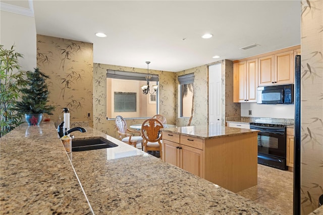 kitchen with kitchen peninsula, sink, black appliances, light brown cabinets, and pendant lighting