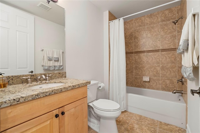 full bathroom with tile patterned flooring, shower / bath combination with curtain, vanity, and toilet