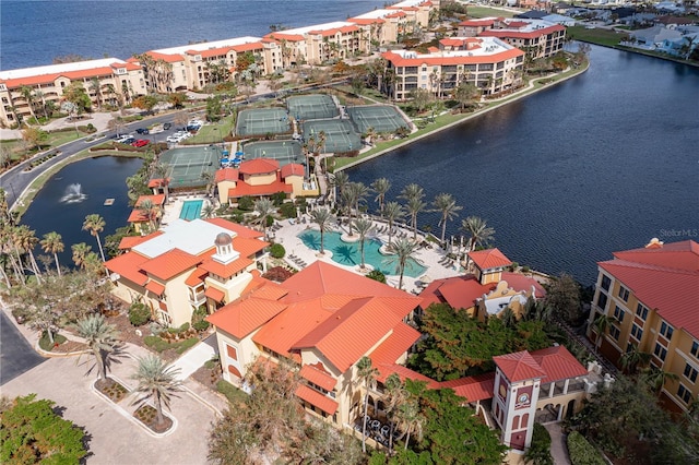 birds eye view of property with a water view