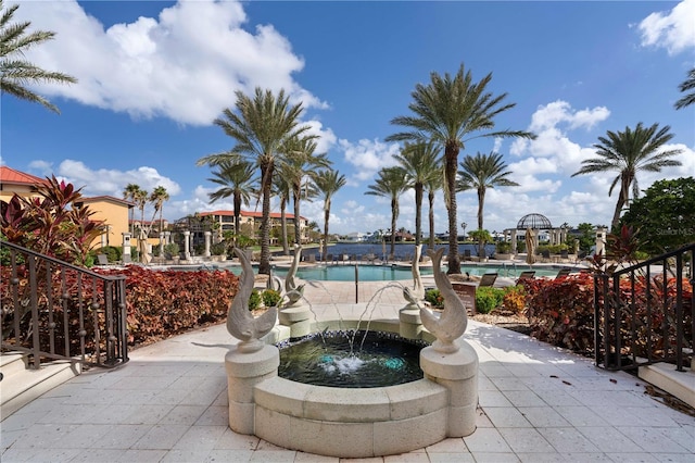 exterior space featuring pool water feature