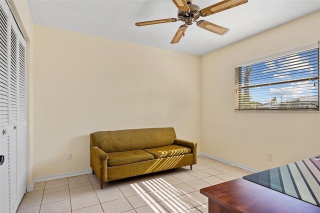 sitting room with ceiling fan and light tile patterned floors