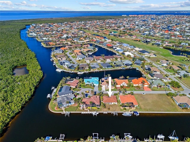 bird's eye view with a water view