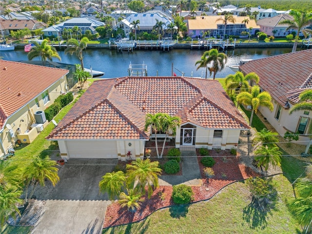 birds eye view of property with a water view