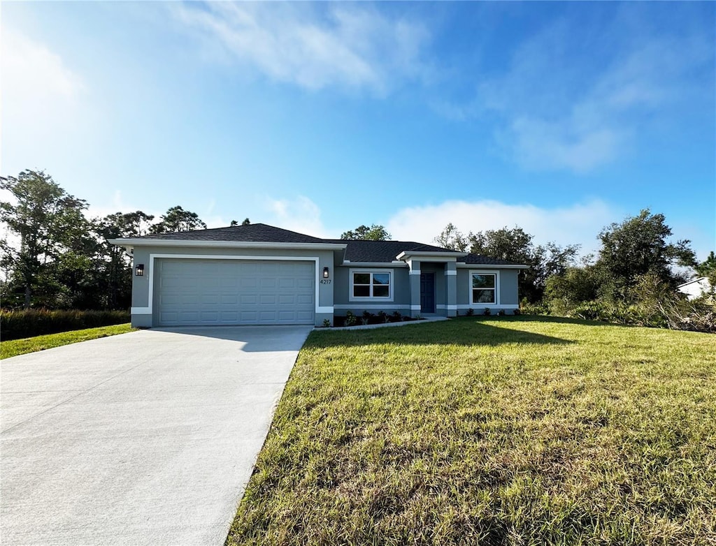 4217 Winfall Ave, North Port, FL 34286 - single story home with a garage and a front lawn