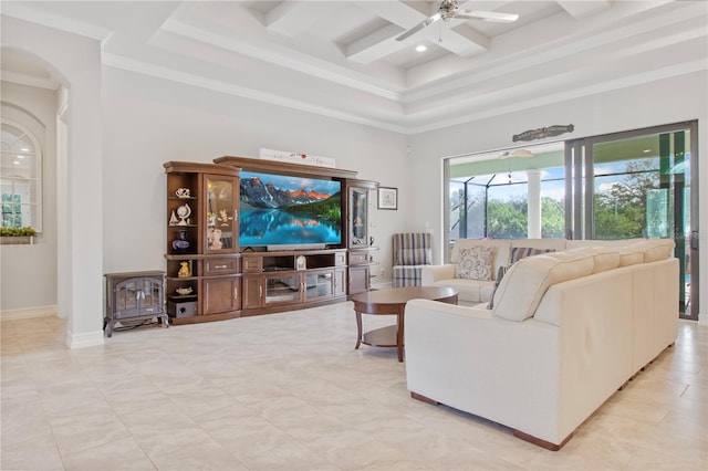 living room with a high ceiling, coffered ceiling, crown molding, ceiling fan, and beamed ceiling