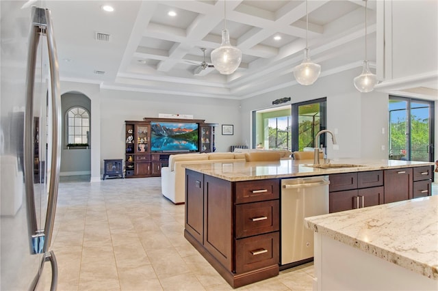 kitchen featuring sink, hanging light fixtures, coffered ceiling, and appliances with stainless steel finishes