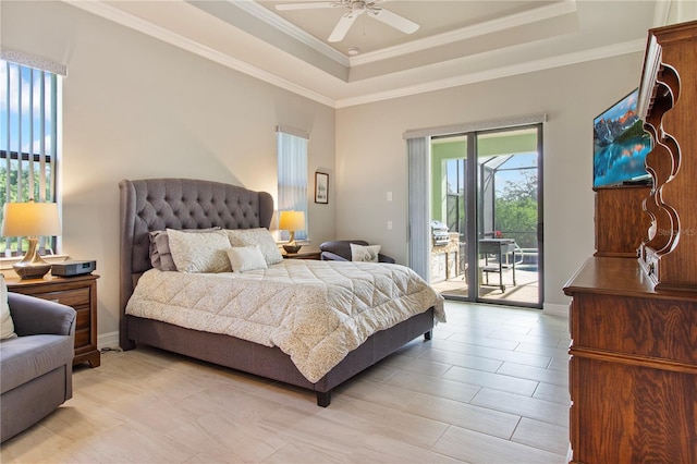 bedroom featuring ceiling fan, a raised ceiling, crown molding, and access to outside