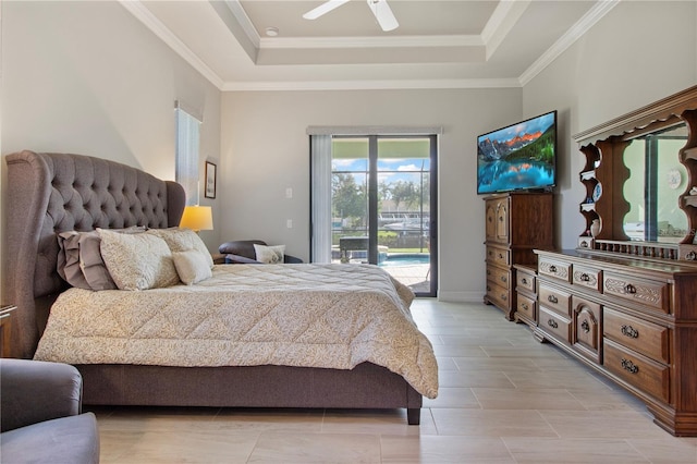 bedroom with a tray ceiling, access to exterior, ceiling fan, and ornamental molding