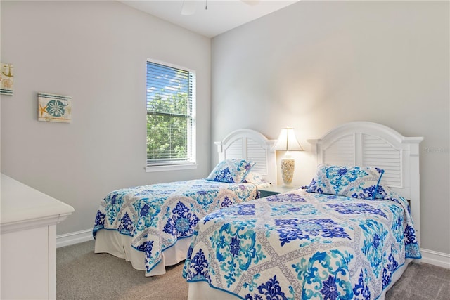 bedroom with ceiling fan and carpet floors