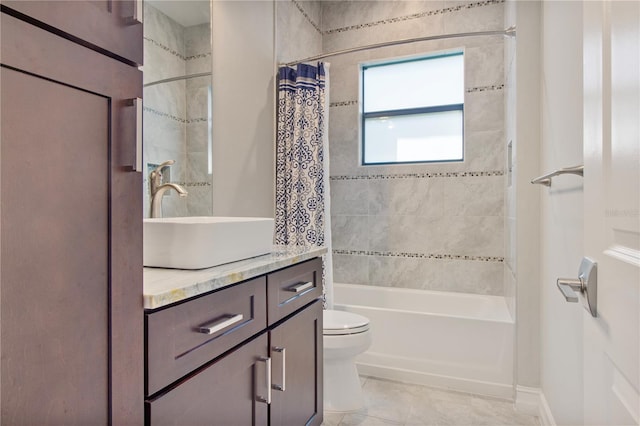 full bathroom with tile patterned floors, vanity, shower / bath combo, and toilet