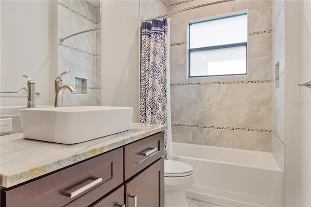 full bathroom featuring shower / tub combo with curtain, vanity, and toilet