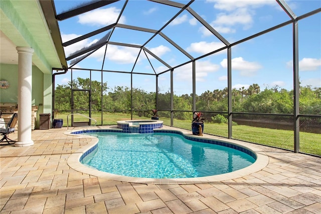 view of pool with a lawn, a patio area, and a lanai