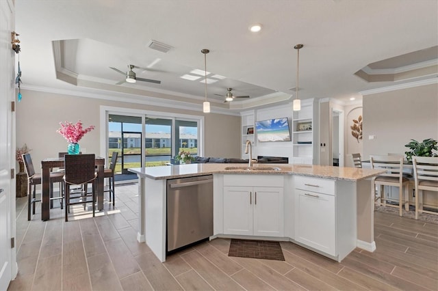 kitchen with dishwasher, white cabinets, a raised ceiling, hanging light fixtures, and ornamental molding