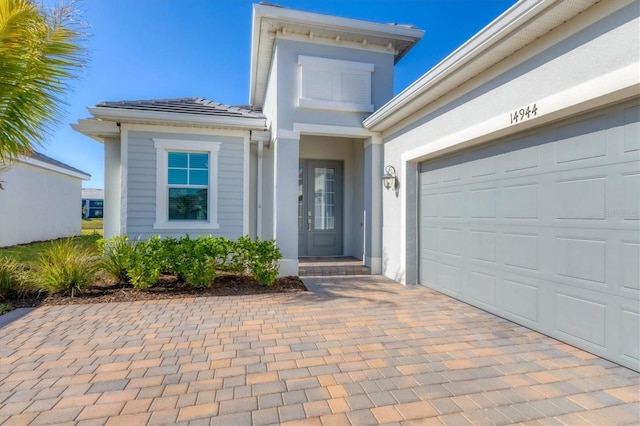 property entrance featuring a garage