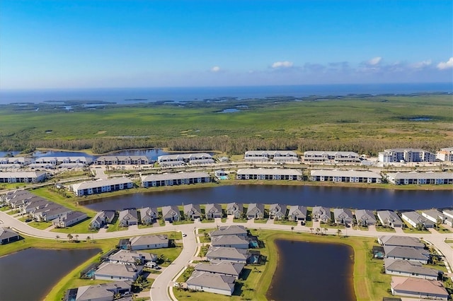 birds eye view of property with a water view