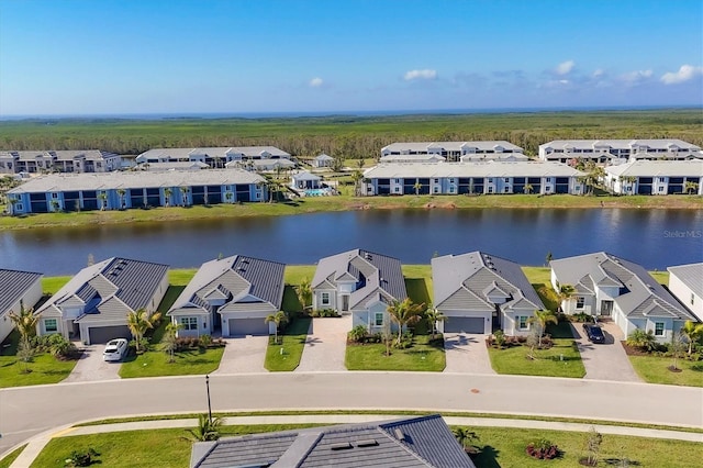 birds eye view of property featuring a water view