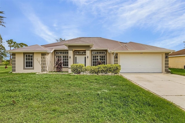 view of front of house featuring a garage and a front lawn