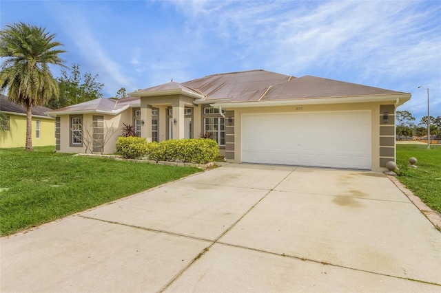 view of front facade with a front lawn and a garage