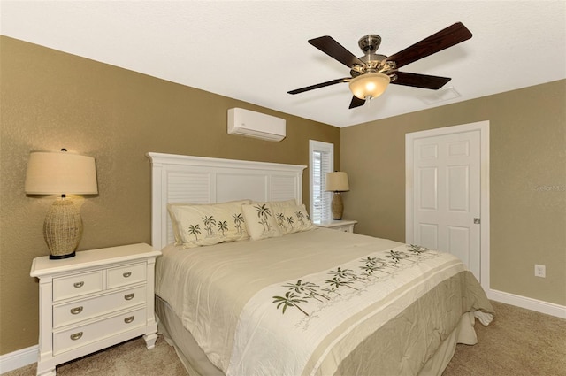 carpeted bedroom featuring a wall mounted AC and ceiling fan