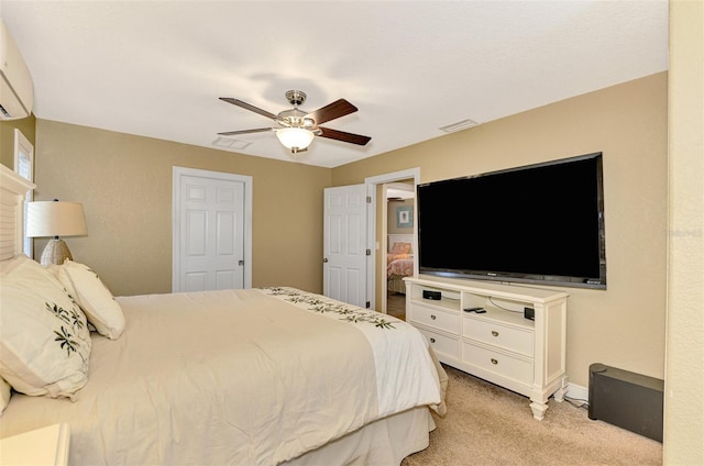 bedroom featuring light carpet and ceiling fan