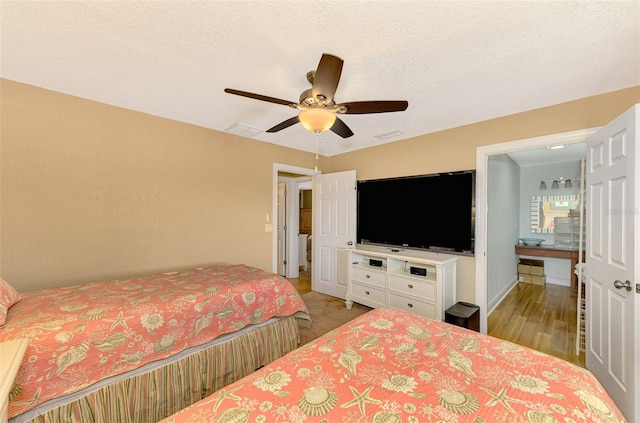 bedroom with light wood-type flooring and ceiling fan