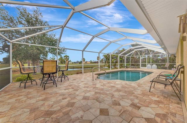 view of swimming pool featuring a lanai and a patio area