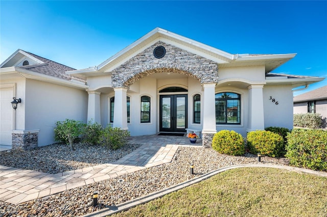 entrance to property featuring french doors