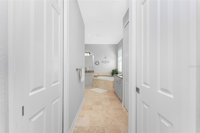 bathroom with tiled tub