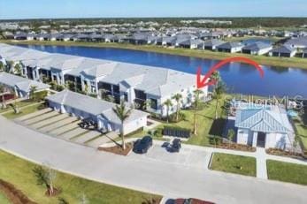 birds eye view of property with a water view