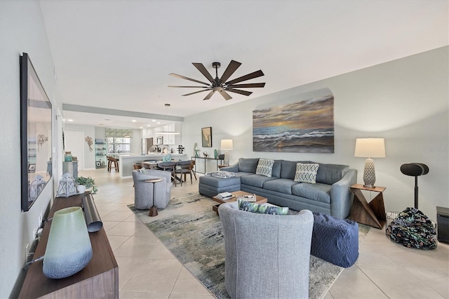 living room with ceiling fan and light tile patterned flooring