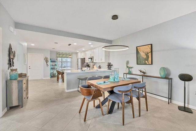 dining area featuring light tile patterned floors