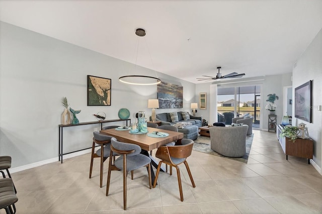 tiled dining space with ceiling fan