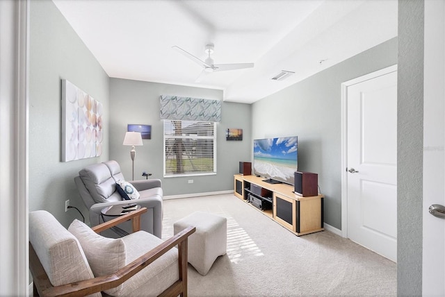 living room with ceiling fan and light colored carpet