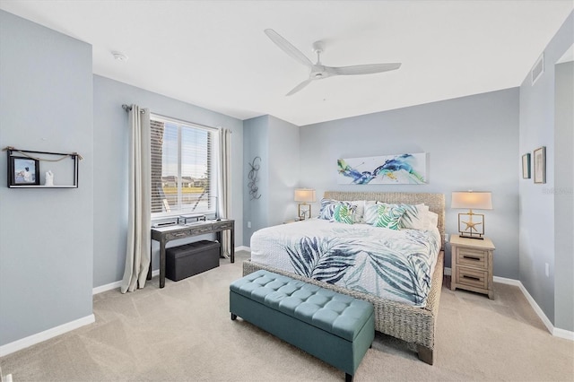 bedroom featuring light colored carpet and ceiling fan