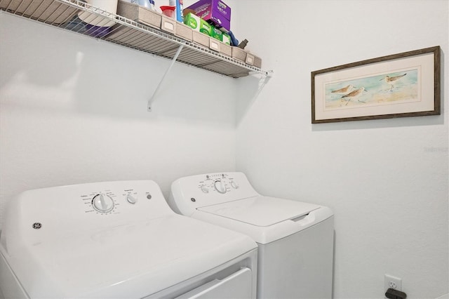 washroom featuring washer and clothes dryer