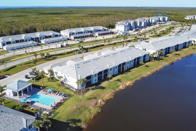 birds eye view of property with a water view