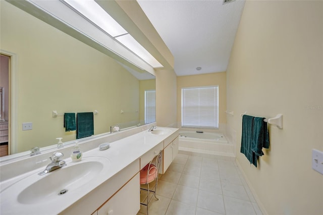 bathroom featuring vanity, tile patterned flooring, and a relaxing tiled tub