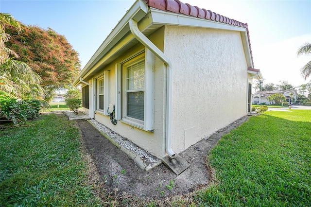 view of home's exterior featuring a yard