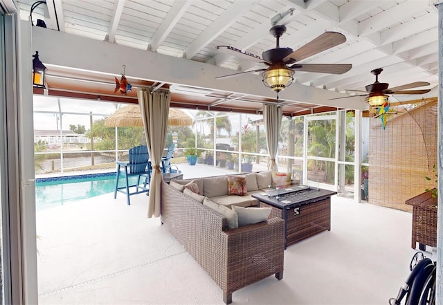 interior space featuring ceiling fan, beam ceiling, and a pool