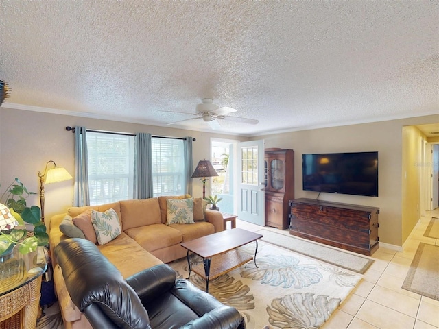 tiled living room featuring ceiling fan, crown molding, and a textured ceiling