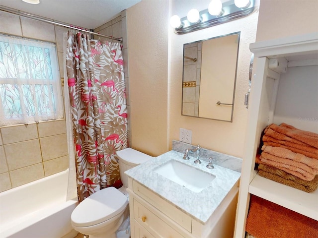 full bathroom with vanity, shower / bath combo, and toilet