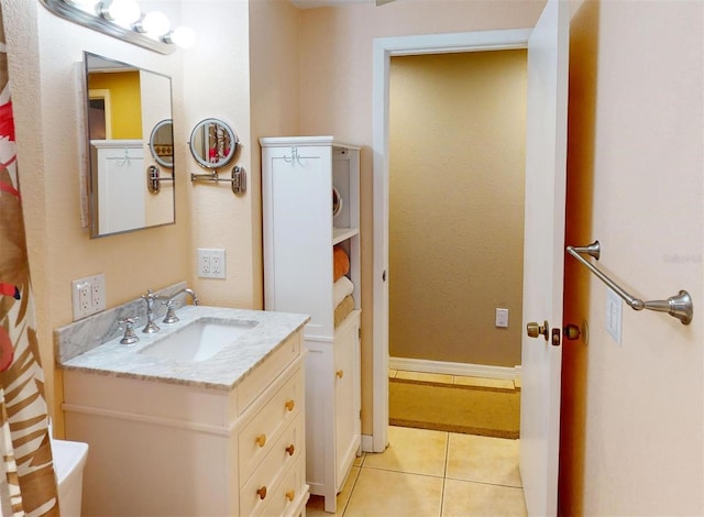 bathroom with tile patterned floors and vanity