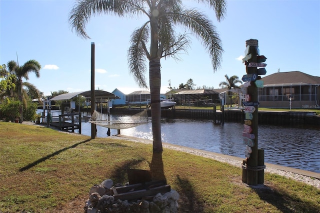 exterior space with a yard and a water view