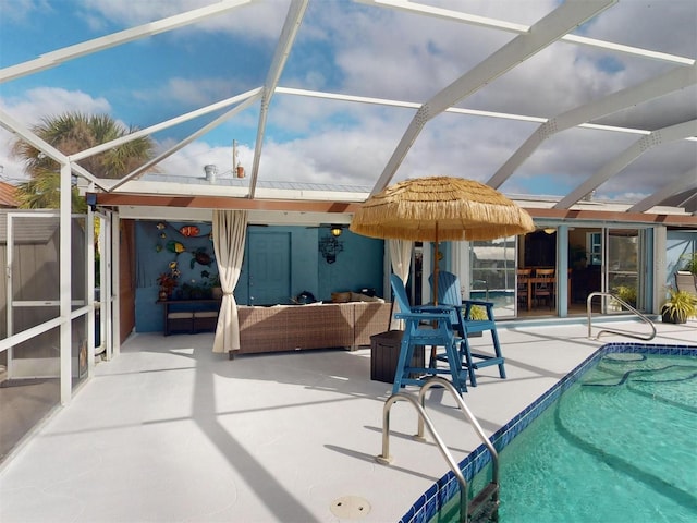 view of pool with a patio and glass enclosure