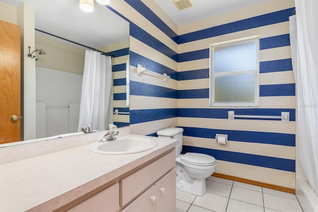 full bathroom featuring tile patterned flooring, shower / bath combination with curtain, vanity, and toilet