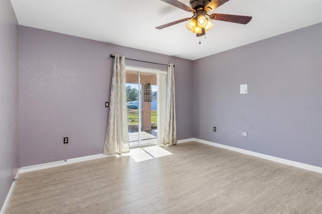 empty room featuring ceiling fan and light hardwood / wood-style floors