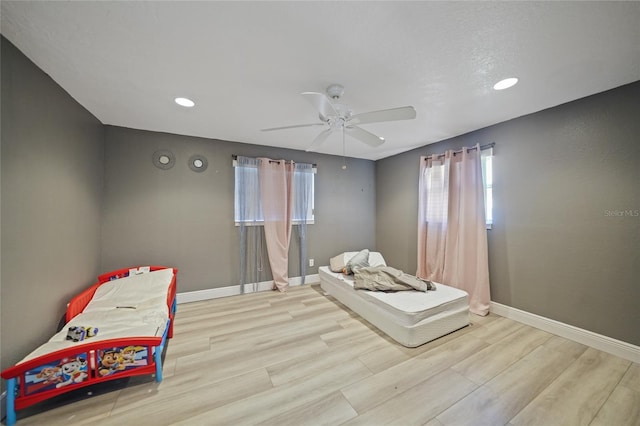 bedroom featuring ceiling fan and light hardwood / wood-style floors